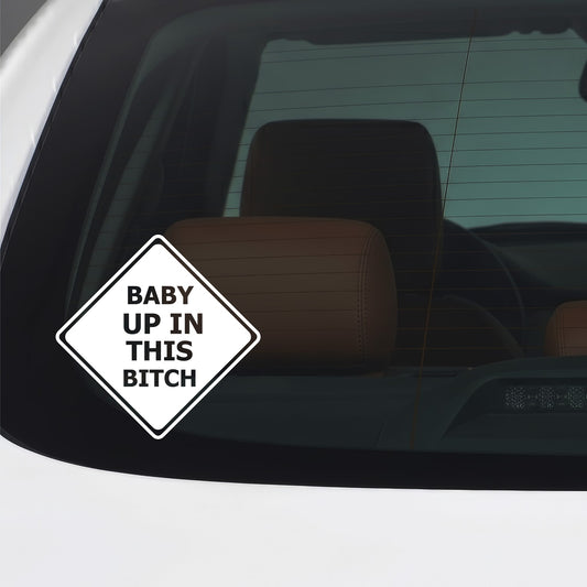 White "Baby up in this Bitch" sticker applied to a car window.