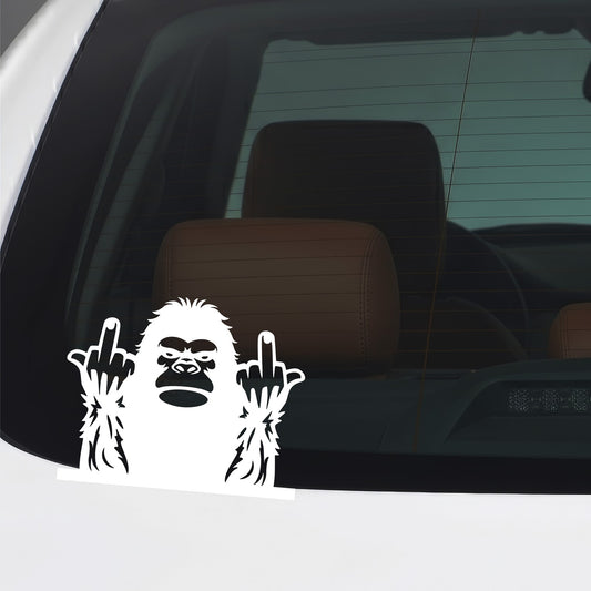 White Bigfoot middle fingers sticker applied to a car window.