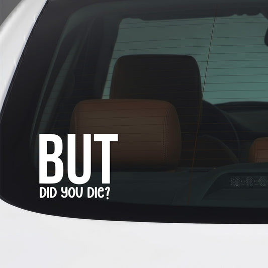 White "But Did You Die" sticker applied to a car window.