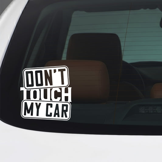 White Don't Touch My Car vinyl sticker applied to a car window.