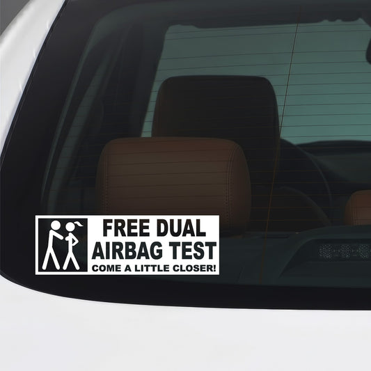 White Free Dual Airbag Test sticker applied to a car window.