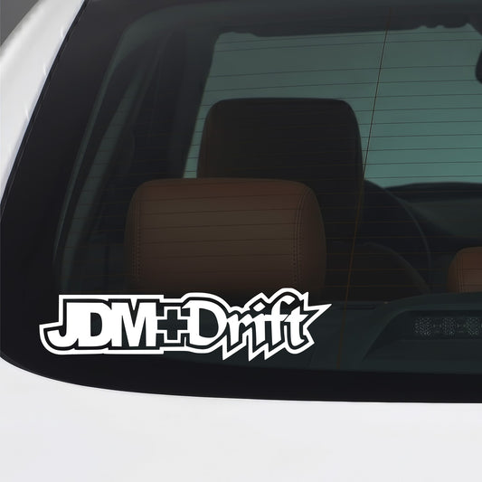 White JDM Drift sticker applied to a car window.