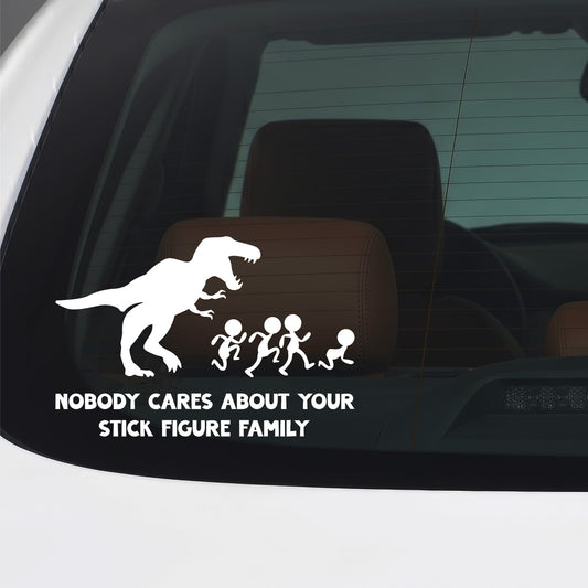 White "Nobody Cares" stick figure family and T-Rex vinyl sticker applied to a car window.