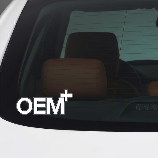 White OEM Plus sticker applied to a car window.