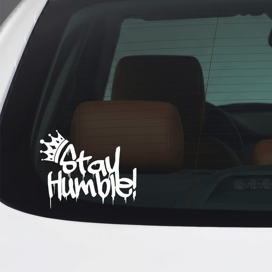 White Stay Humble graffiti crown sticker applied to a car window.