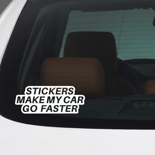 White "Stickers make my car go faster" vinyl decal applied to a car window.