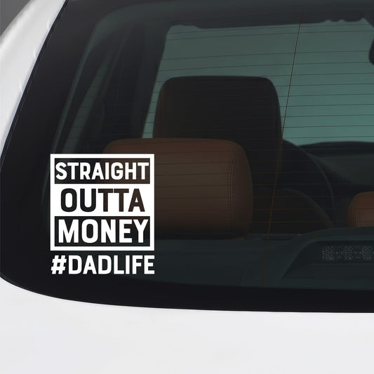 White Straight Outta Money Dad Life sticker applied to a car window.