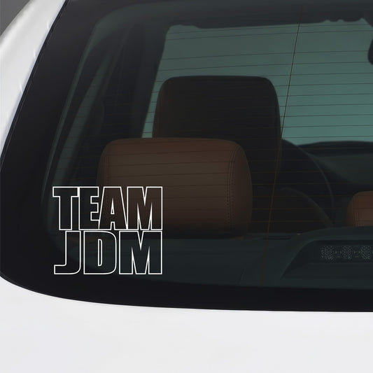White Team JDM vinyl sticker applied to a car window.