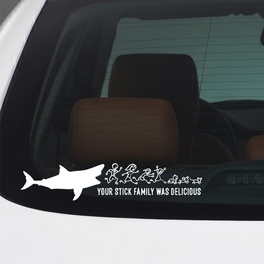 White Your Stick Family Was Delicious shark sticker applied to a car window.