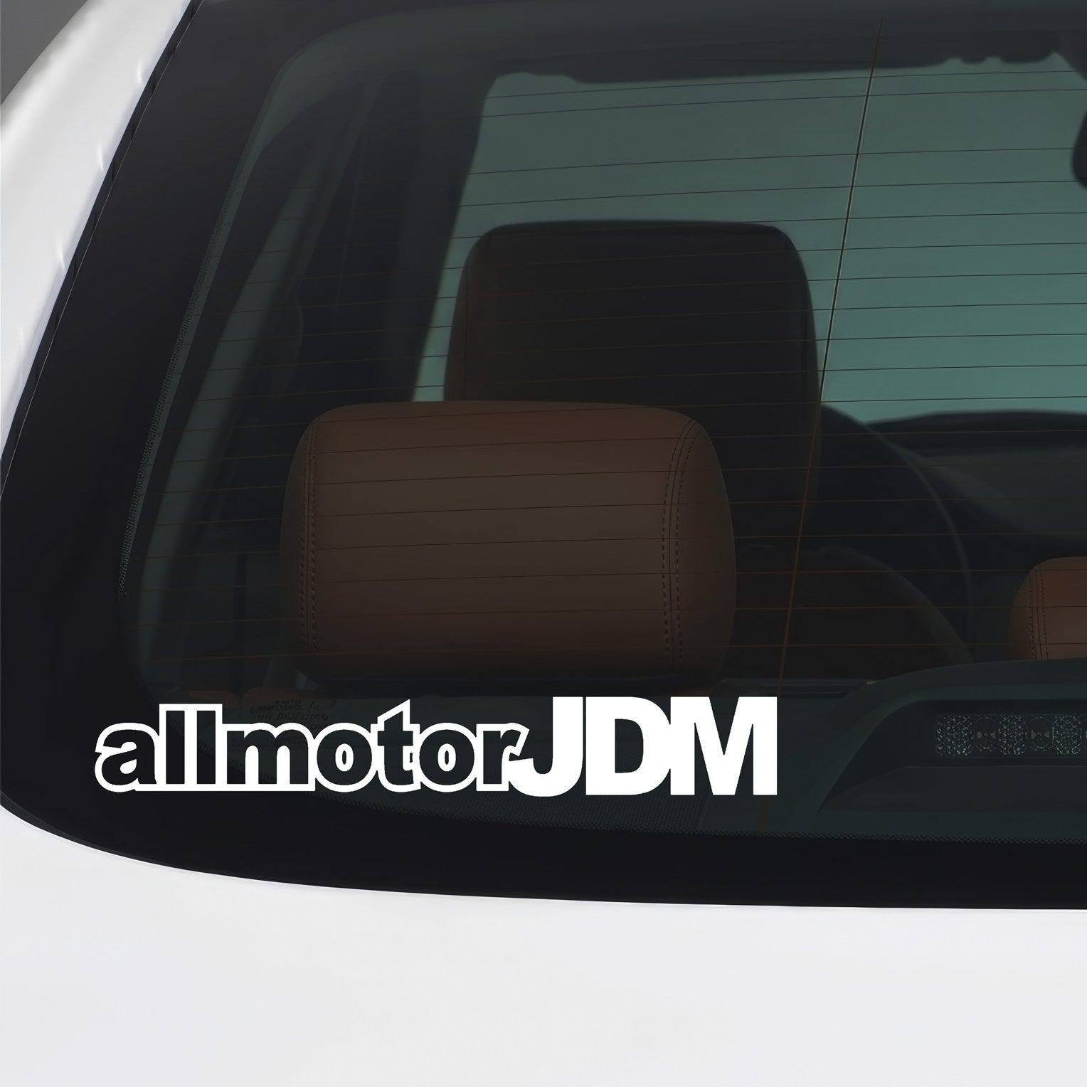 White All Motor JDM car window sticker applied to a car window.