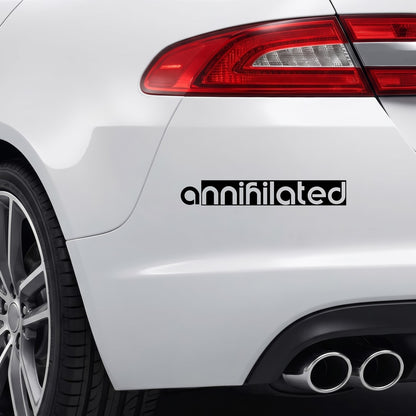 Black annihilated vinyl sticker applied to a car rear bumper.