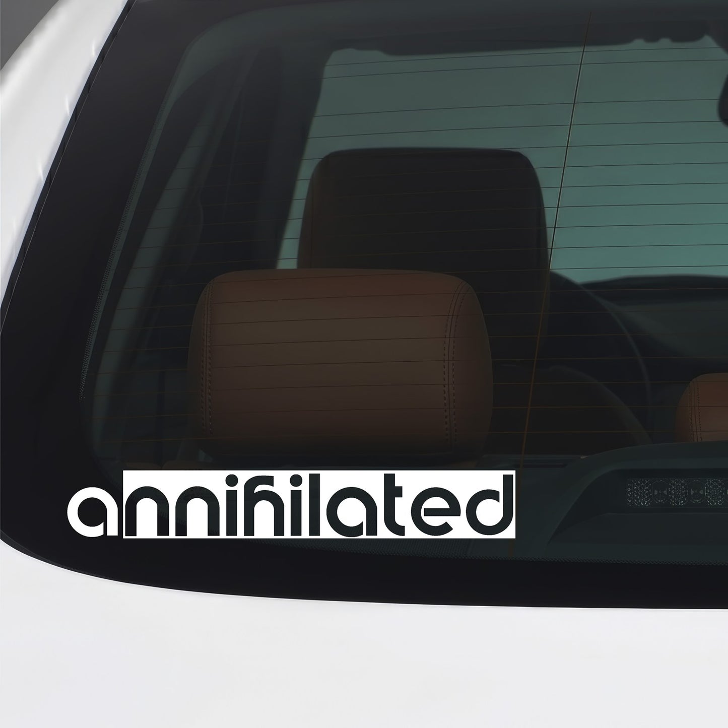 White "Annihilated" vinyl sticker applied to a car window.