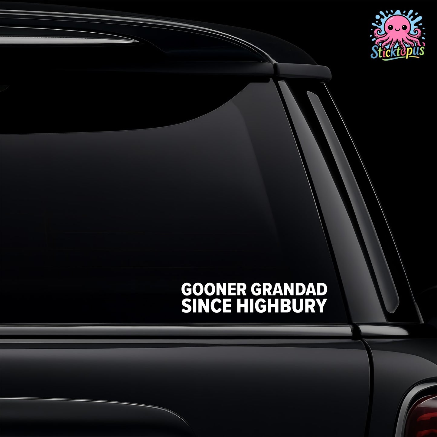 Car window with a decal reading 'GOONER GRANDAD SINCE Highbury' on a black background.