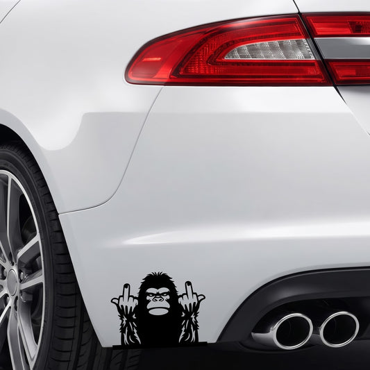 Black Bigfoot middle fingers vinyl sticker applied to a car rear bumper.