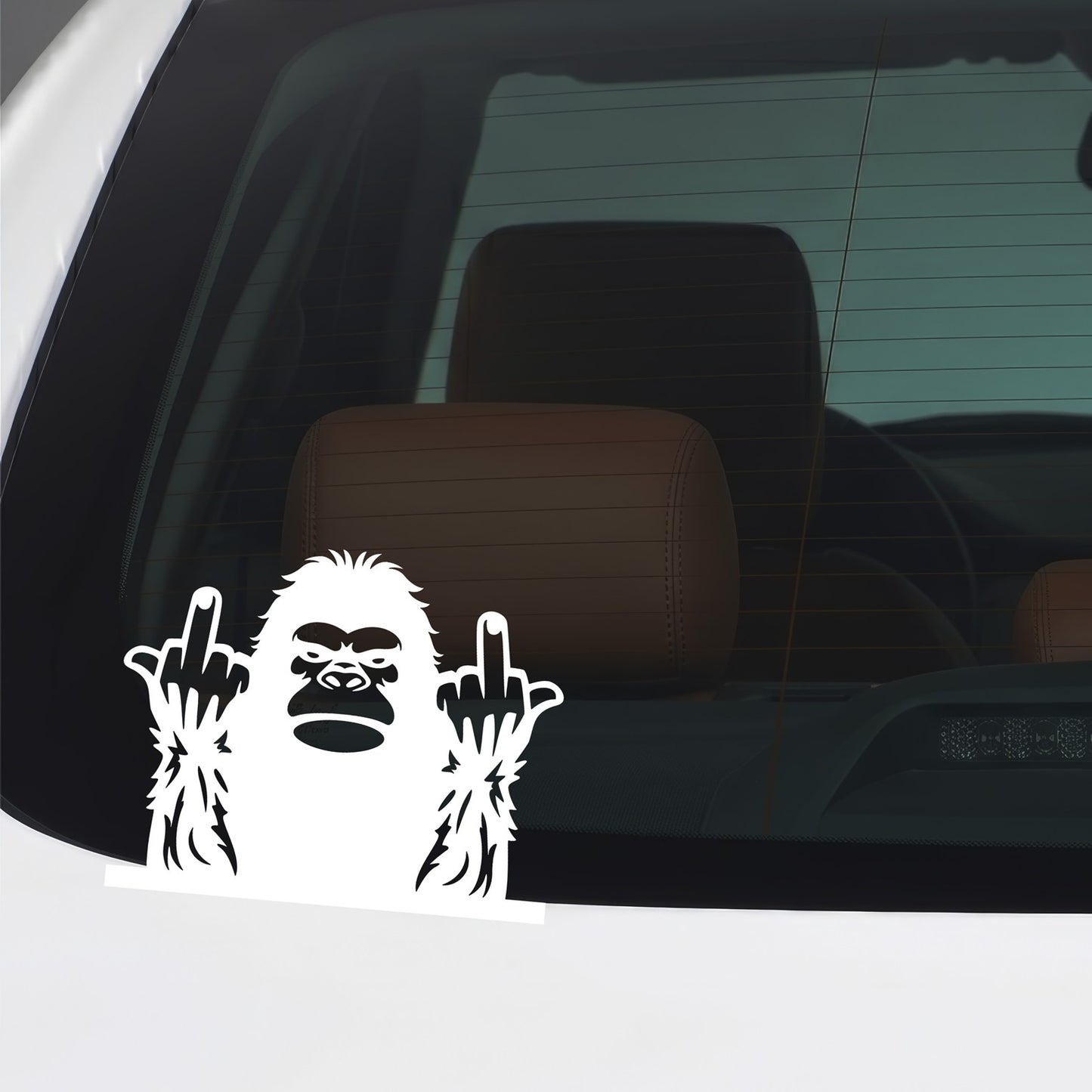 White Bigfoot middle fingers sticker applied to a car window.