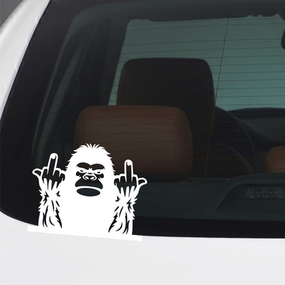 White Bigfoot middle fingers sticker applied to a car window.