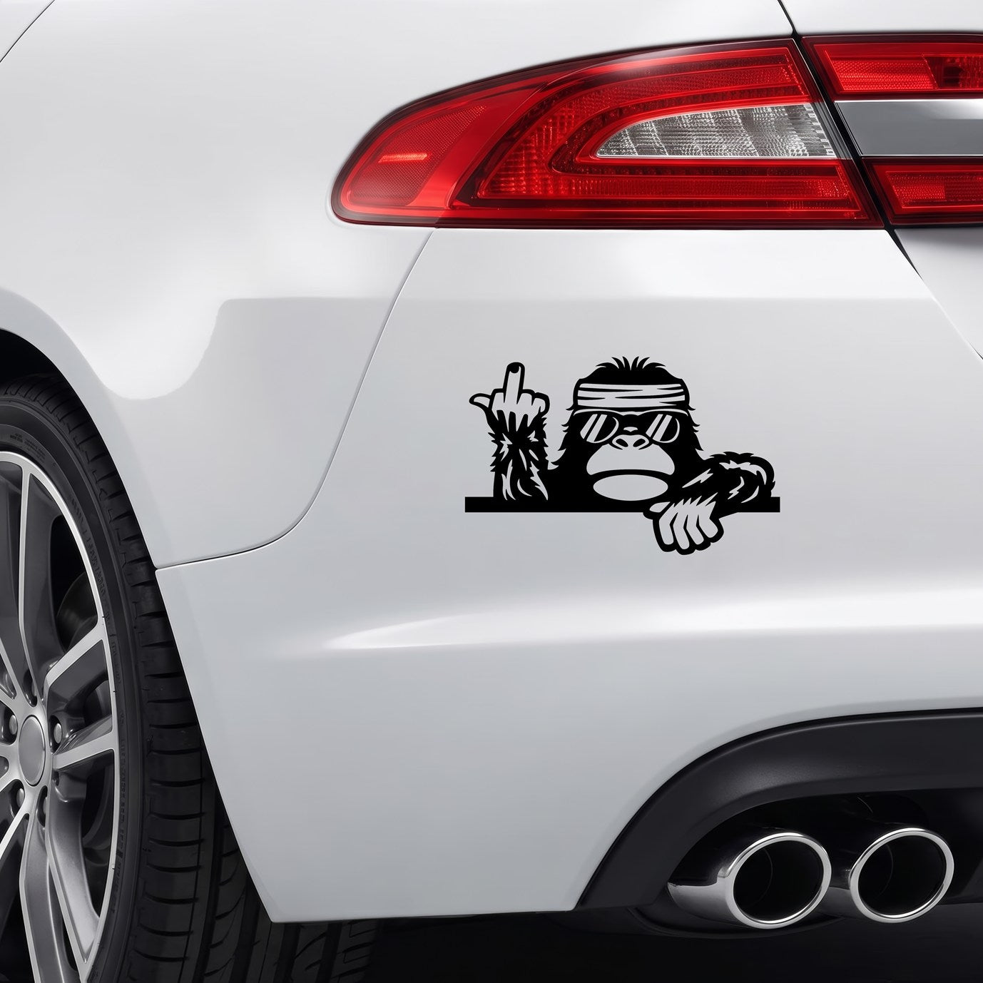 Black Cool Bigfoot Middle Finger sticker applied to a car rear bumper.
