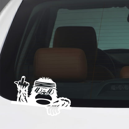White Bigfoot middle finger sticker applied to a car window.