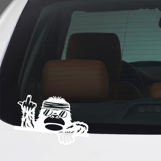 White Bigfoot middle finger sticker applied to a car window.