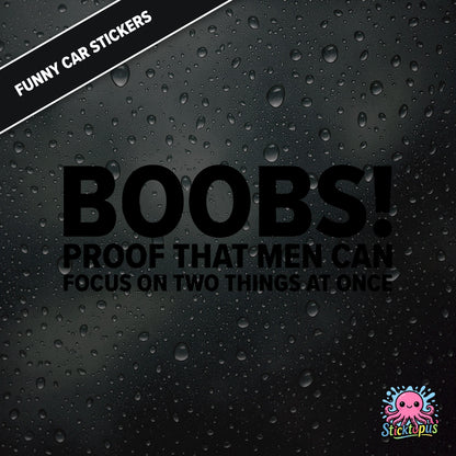 Boobs! PROOF THAT MEN CAN FOCUS ON TWO THINGS AT ONCE — bold black text, cheeky multitasking joke sticker.
