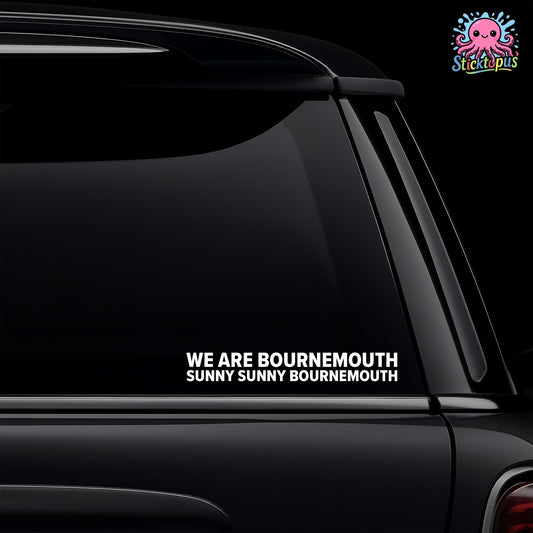Car window with a decal reading 'WE ARE BOURNEMOUTH SUNNY SUNNY BOURNEMOUTH' on a black background.