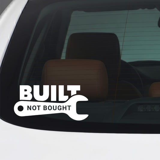 White Built Not Bought sticker applied to a car window.