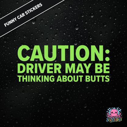 Caution: Driver May Be Thinking About Butts — cheeky caution sticker in green text, surreal distraction warning.