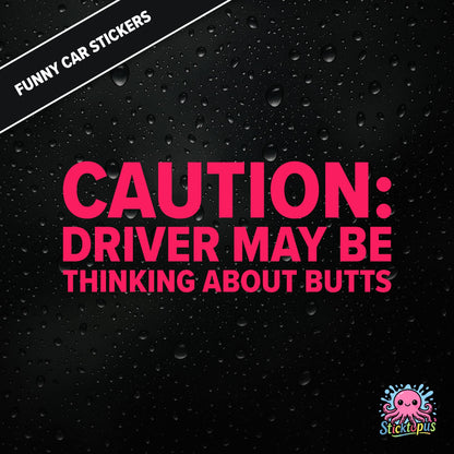 Caution: Driver May Be Thinking About Butts — cheeky caution sticker in pink text, surreal distraction warning.