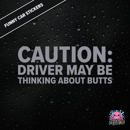 Caution: Driver May Be Thinking About Butts — cheeky caution sticker in silver text, surreal distraction warning.