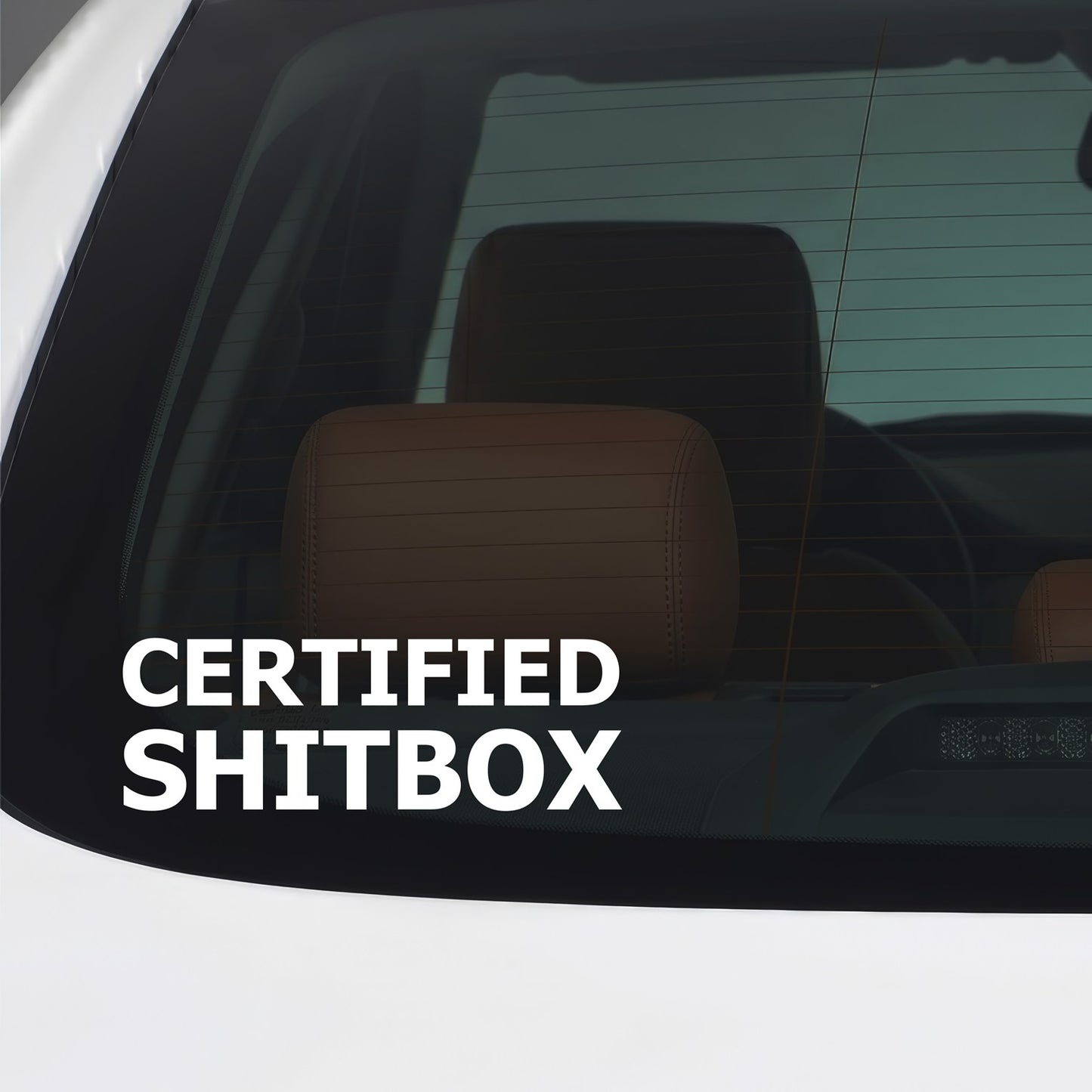 White Certified Shitbox sticker applied to a car window.