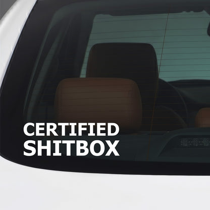 White Certified Shitbox sticker applied to a car window.