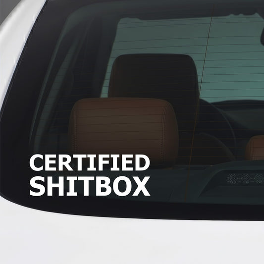White Certified Shitbox sticker applied to a car window.