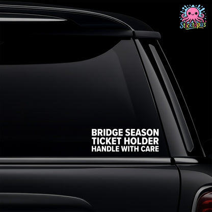 Car window with 'BRIDGE SEASON TICKET HOLDER HANDLE WITH CARE' sticker and Sticktopus logo.
