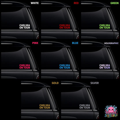 Car window with 'Chelsea On Tour' decal in various colors.