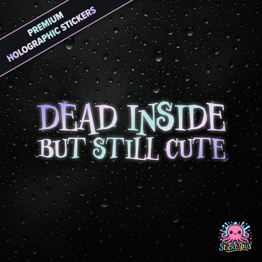 Premium holographic sticker with the phrase “DEAD INSIDE BUT STILL CUTE” in bold, pastel-shifting text on a black background with water droplets.