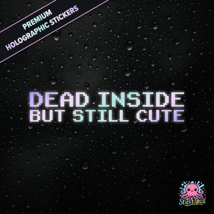 Premium holographic sticker with the phrase “DEAD INSIDE BUT STILL CUTE” in bold, pastel-shifting text on a black background with water droplets.