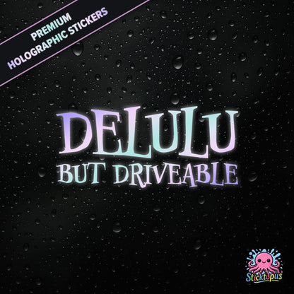 Premium holographic sticker with the phrase “DELULU BUT DRIVEABLE” in bold, pastel-shifting text on a black background with water droplets.