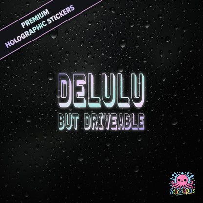 Premium holographic sticker with the phrase “DELULU BUT DRIVEABLE” in bold, pastel-shifting text on a black background with water droplets.