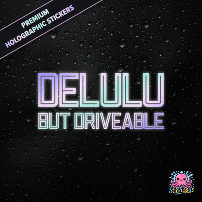 Premium holographic sticker with the phrase “DELULU BUT DRIVEABLE” in bold, pastel-shifting text on a black background with water droplets.