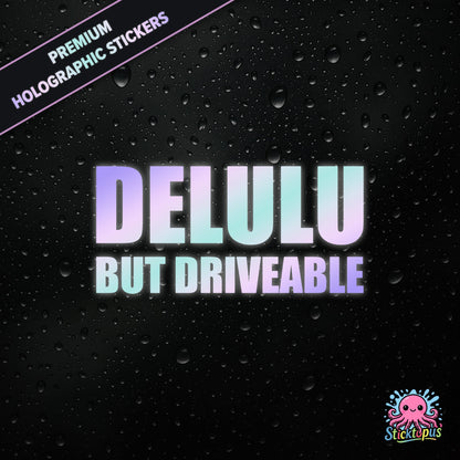 Premium holographic sticker with the phrase “DELULU BUT DRIVEABLE” in bold, pastel-shifting text on a black background with water droplets.