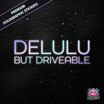 Premium holographic sticker with the phrase “DELULU BUT DRIVEABLE” in bold, pastel-shifting text on a black background with water droplets.