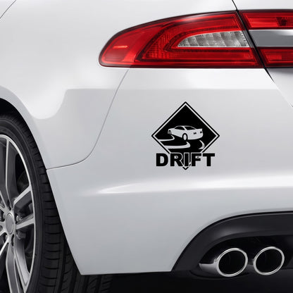 Black DRIFT vinyl sticker applied to a car rear bumper.