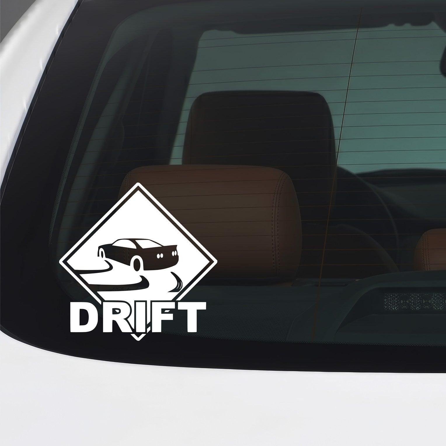 White drift vinyl sticker applied to a car window.