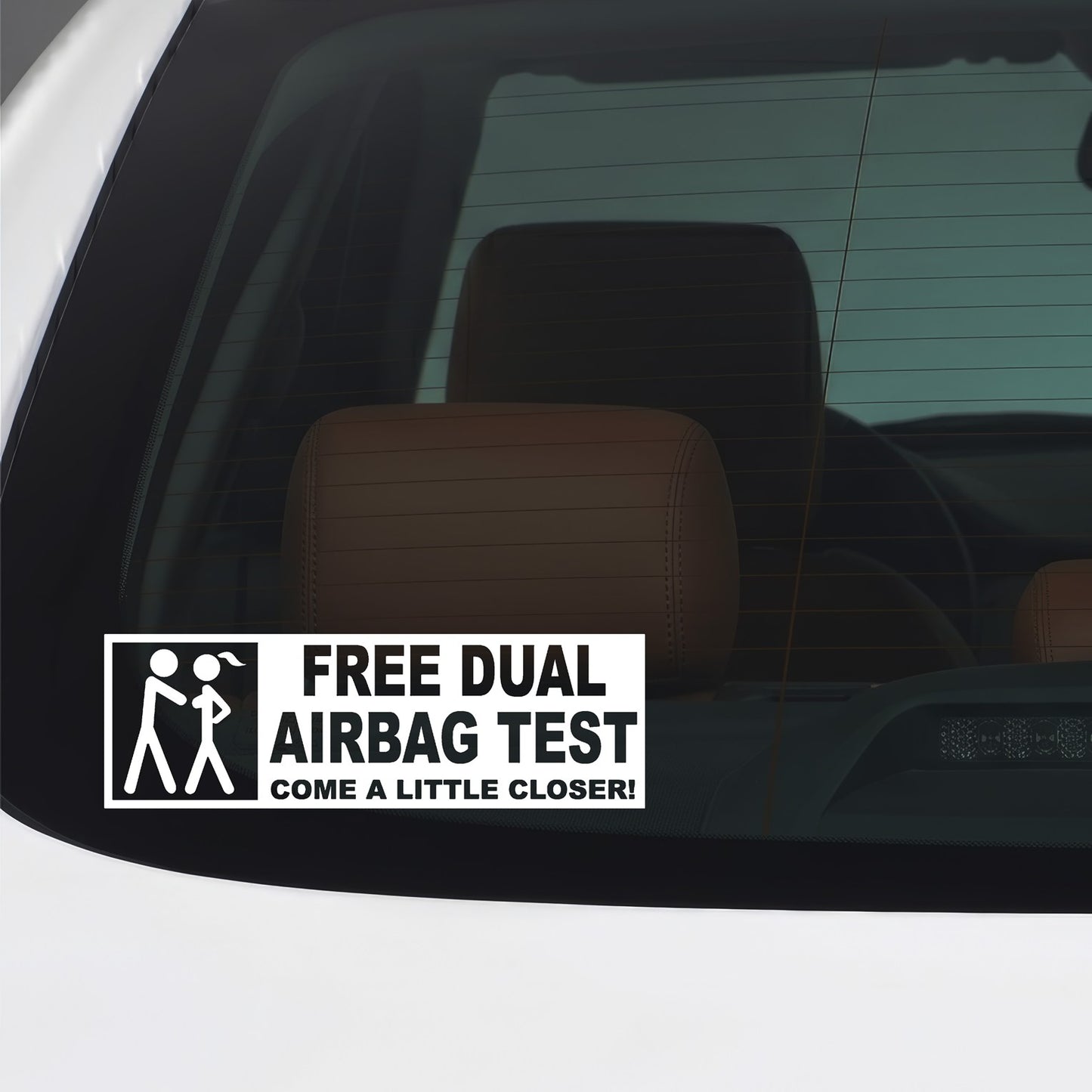 White Free Dual Airbag Test sticker applied to a car window.