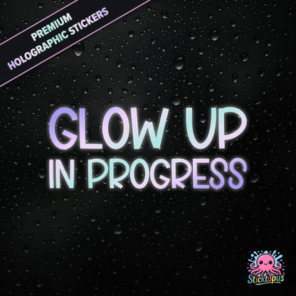 Premium holographic sticker with the phrase “Glow Up in Progress” in bold, pastel-shifting text on a black background with water droplets.