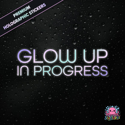 Premium holographic sticker with the phrase “Glow Up in Progress” in bold, pastel-shifting text on a black background with water droplets.