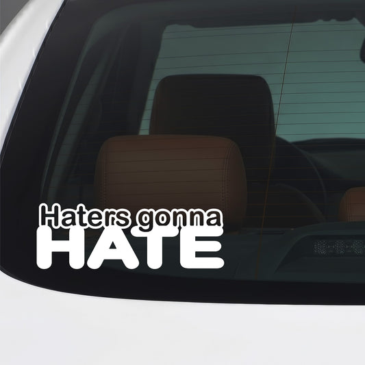 White Haters Gonna Hate sticker applied to a car window.