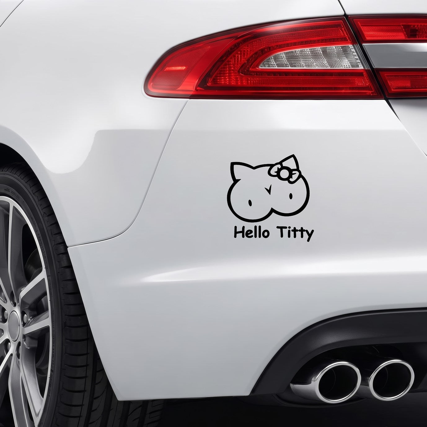 Black Hello Titty vinyl sticker applied to a car rear bumper.