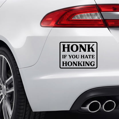 Black Honk If You Hate Honking vinyl sticker applied to a car bumper.