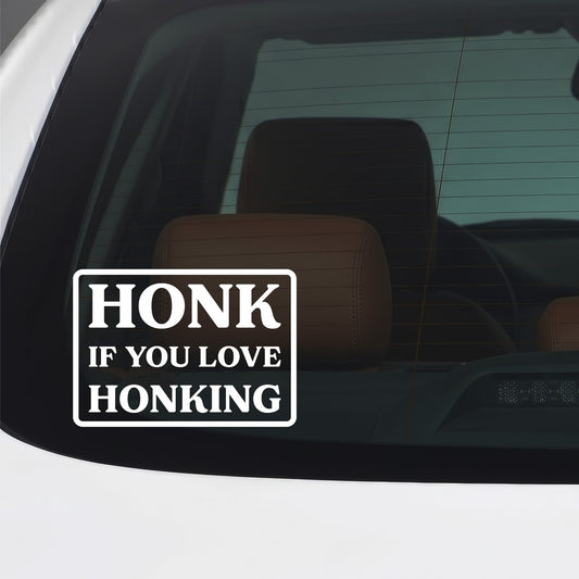 White Honk If You Love Honking sticker applied to a car window.